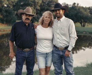 Adan Banuelos poses with his mother and father.