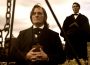 Kim Coates as Brigham Young and Alex Breaux as Wild Bill Hickman in "American Primeval"